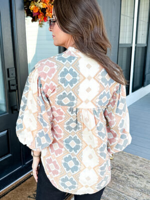 Split V-neck blouse with tassel tie detail