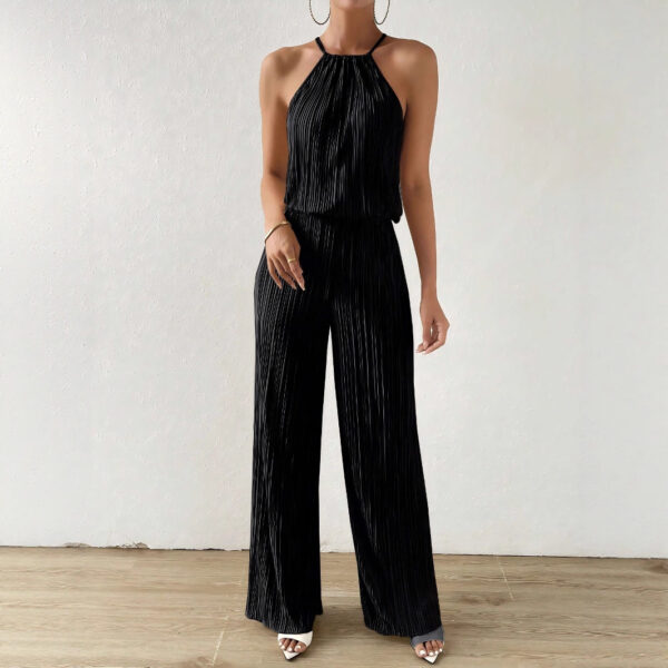 Neck strap top paired with long black pants