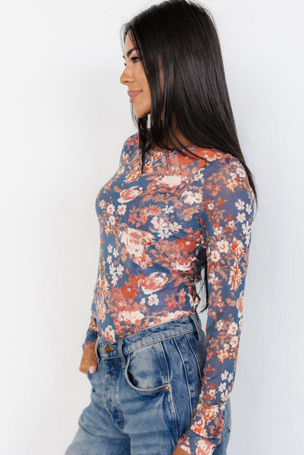 Round-neck floral mesh top styled for casual outfits